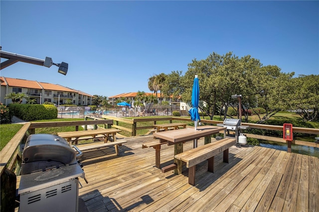 wooden deck featuring a swimming pool