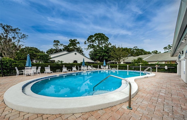 view of pool with a patio area