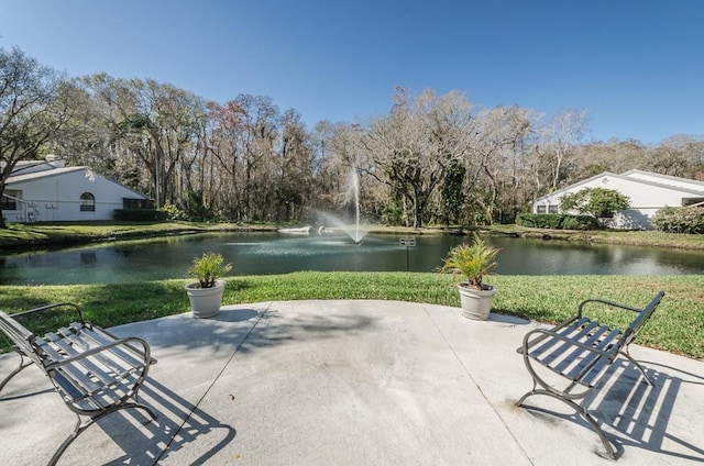 view of patio with a water view