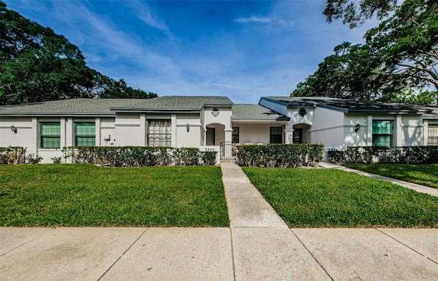 view of front of home with a front lawn