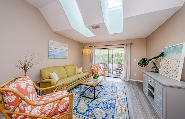 living room with a skylight and wood-type flooring