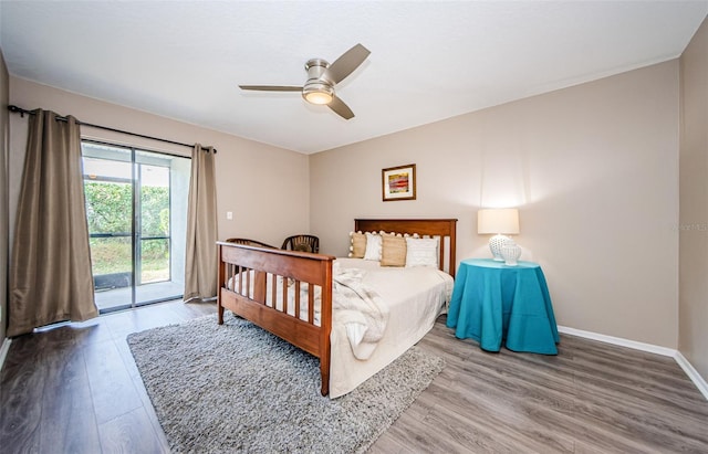 bedroom featuring hardwood / wood-style floors, access to outside, and ceiling fan