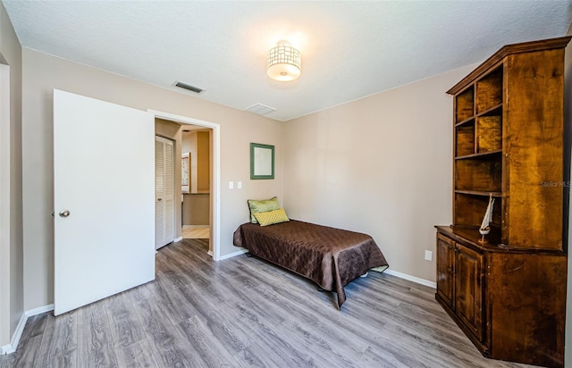 bedroom featuring light hardwood / wood-style floors