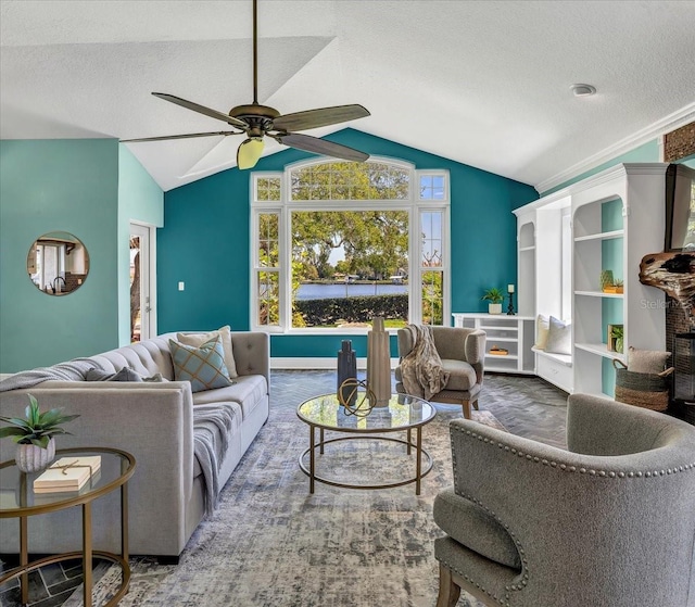 carpeted living room with ceiling fan, a textured ceiling, and lofted ceiling