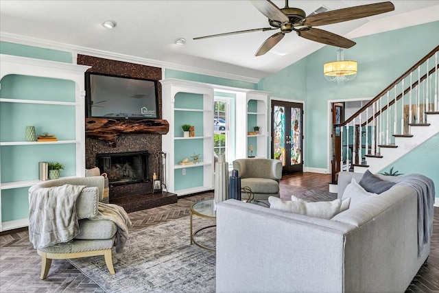 living room featuring a large fireplace, dark parquet flooring, ceiling fan, lofted ceiling, and ornamental molding