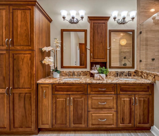 bathroom with vanity and a tile shower