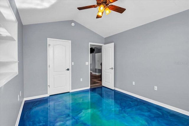 unfurnished bedroom with lofted ceiling and ceiling fan