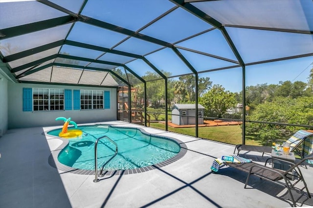 view of pool with a patio area, an outdoor structure, a lanai, and a lawn