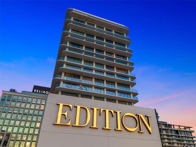 view of outdoor building at dusk