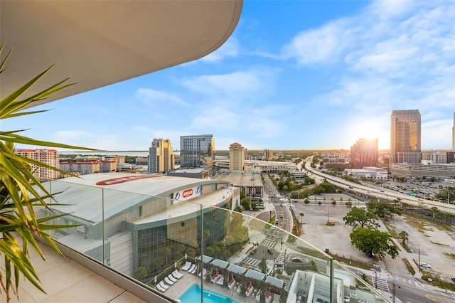 balcony featuring a community pool