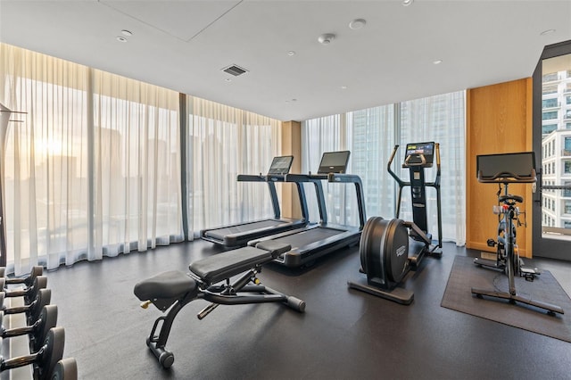 workout area with floor to ceiling windows