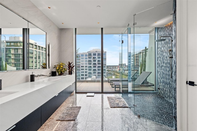 bathroom with oversized vanity, an enclosed shower, double sink, and tile flooring