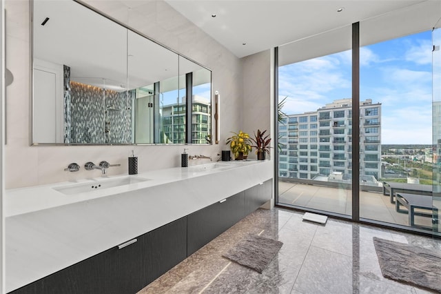 bathroom featuring backsplash, tile floors, a wall of windows, and double sink vanity