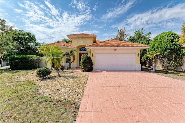 mediterranean / spanish-style house featuring a garage