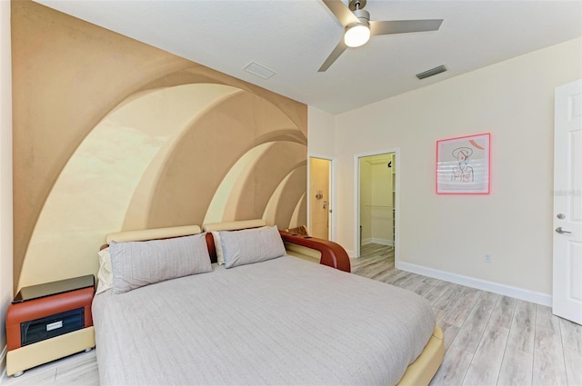 bedroom with light hardwood / wood-style flooring and ceiling fan