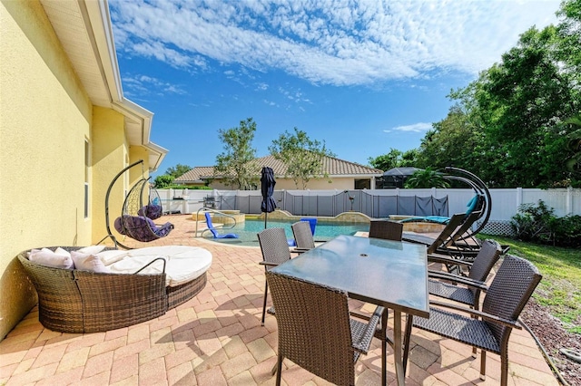 view of patio with a fenced in pool