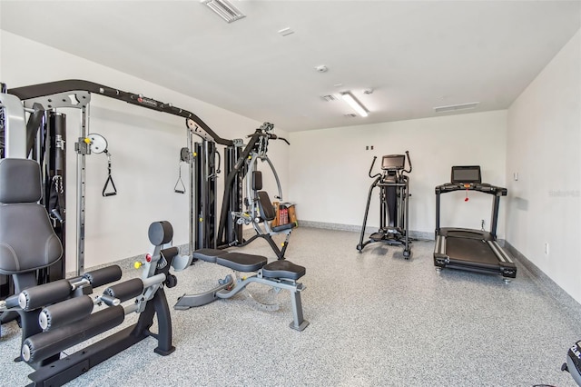 exercise area featuring baseboards and visible vents