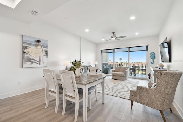 dining room featuring visible vents, baseboards, light wood finished floors, recessed lighting, and ceiling fan