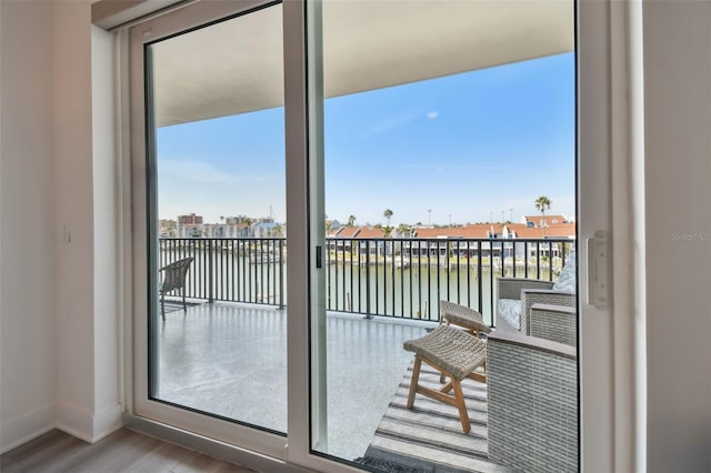 balcony featuring a water view