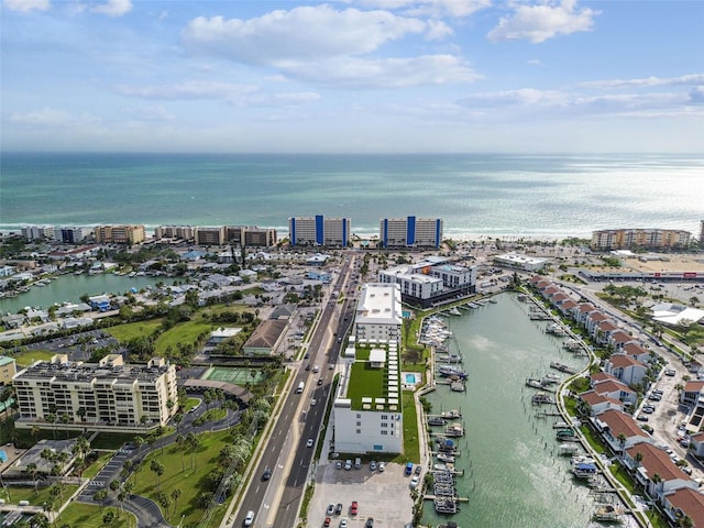 birds eye view of property with a water view and a view of city