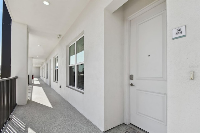 doorway to property with stucco siding