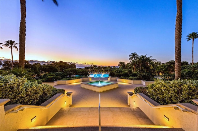 view of patio terrace at dusk