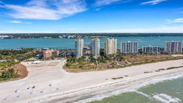 bird's eye view with a beach view and a water view