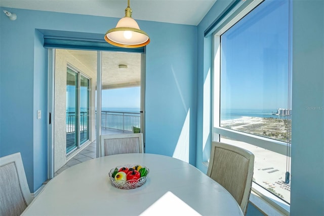 dining room featuring a water view