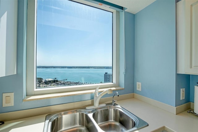 kitchen with sink and a water view