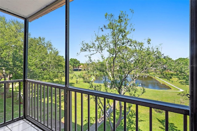 unfurnished sunroom with a water view