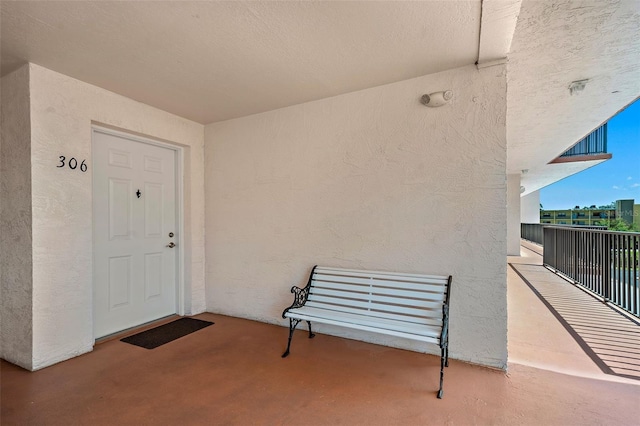 entrance to property with a balcony