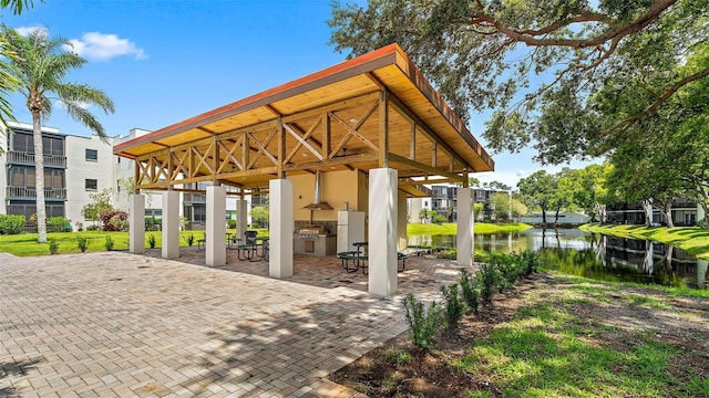 exterior space with a water view and a gazebo