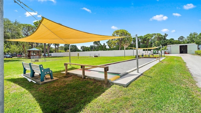 view of nearby features featuring a storage shed and a yard