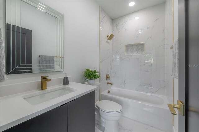 full bathroom with tiled shower / bath combo, toilet, and vanity