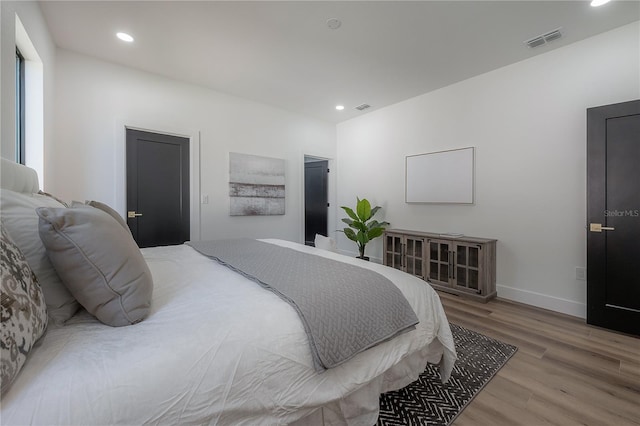 bedroom featuring wood-type flooring