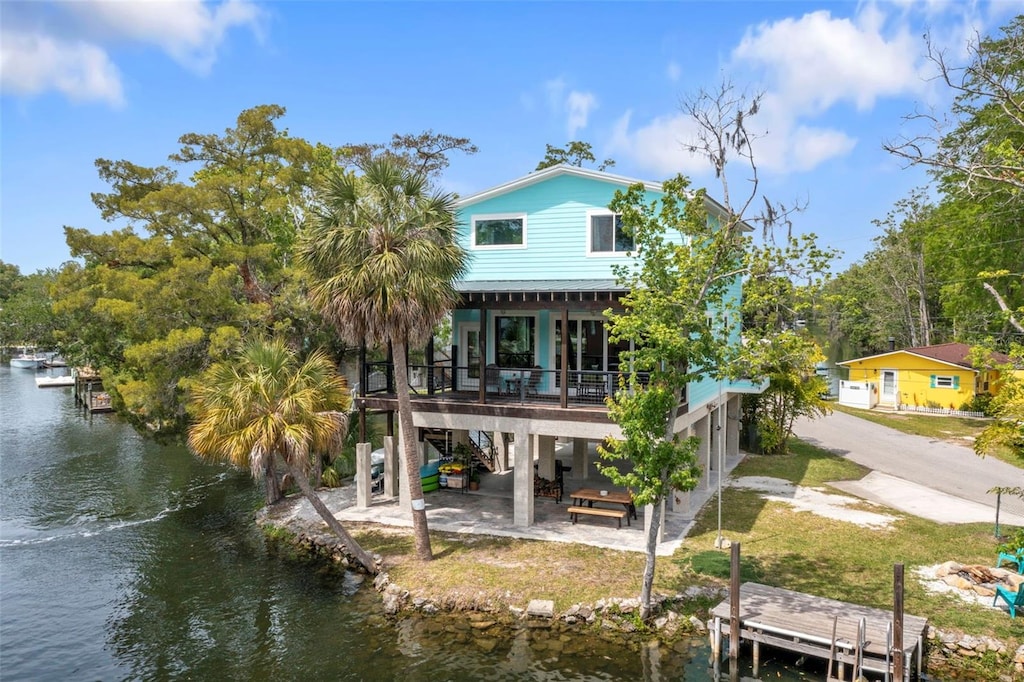 back of house featuring a water view