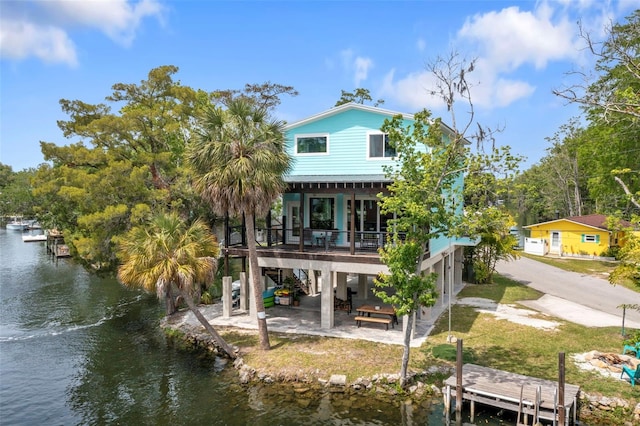 back of house featuring a water view