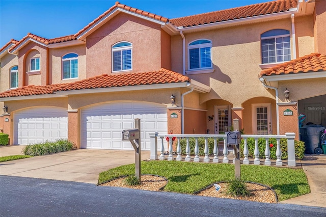 mediterranean / spanish-style home with a porch and a garage