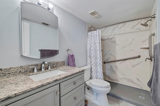 bathroom featuring large vanity, tile flooring, toilet, a textured ceiling, and a shower with curtain