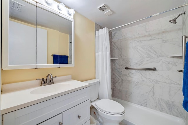 full bathroom featuring vanity with extensive cabinet space, shower / tub combo, and toilet