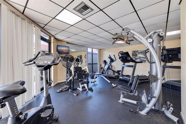 gym featuring a paneled ceiling