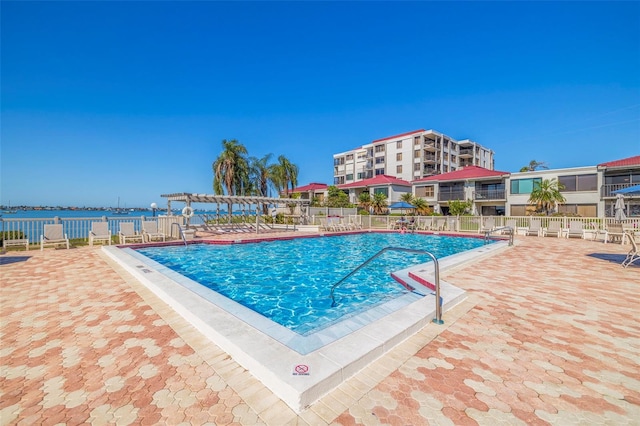 view of pool with a patio and a pergola