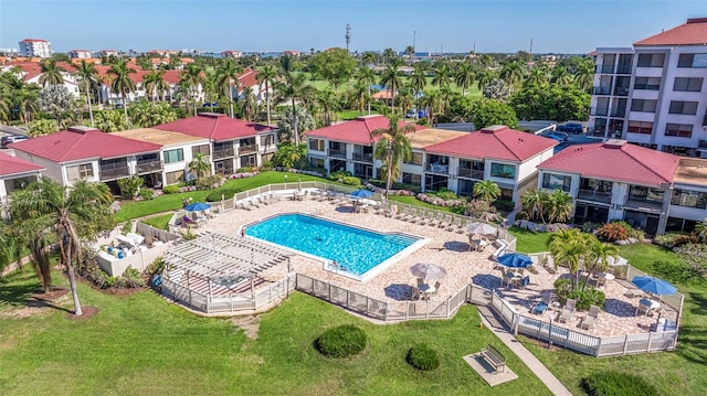 view of swimming pool featuring a patio area and a lawn