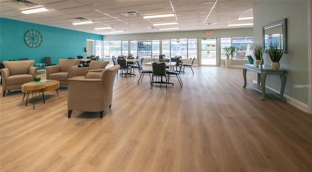 interior space featuring light hardwood / wood-style flooring and a paneled ceiling