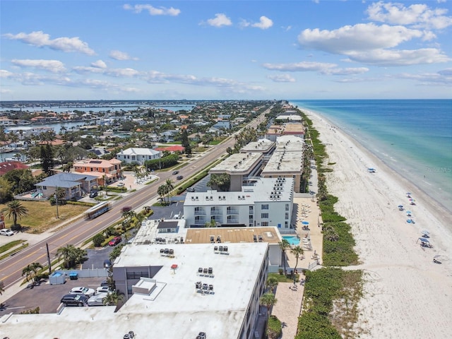 drone / aerial view with a beach view and a water view