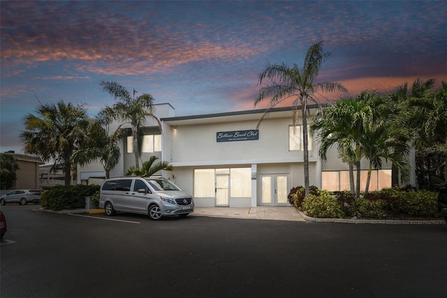 view of outdoor building at dusk