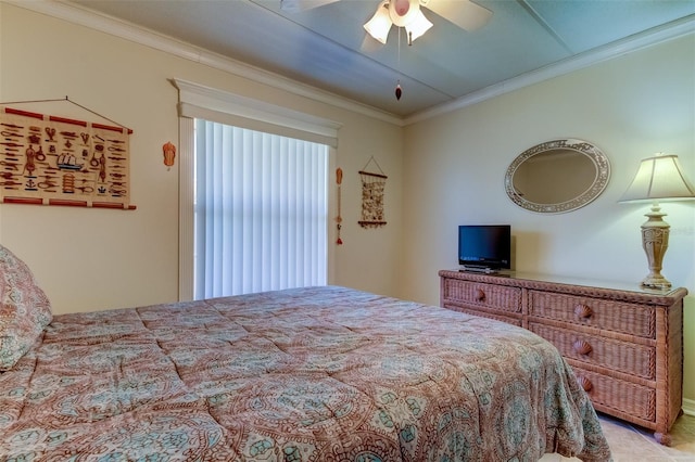 bedroom featuring ceiling fan and ornamental molding