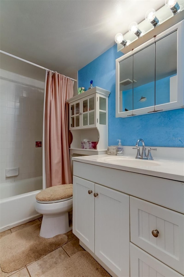 full bathroom with tile flooring, vanity, toilet, and shower / tub combo