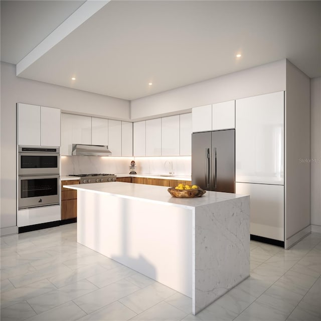 kitchen with decorative backsplash, stainless steel appliances, sink, a center island, and white cabinetry