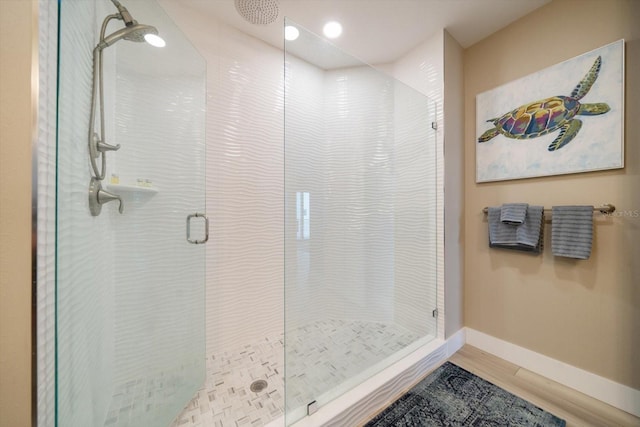 bathroom featuring tile patterned floors and an enclosed shower